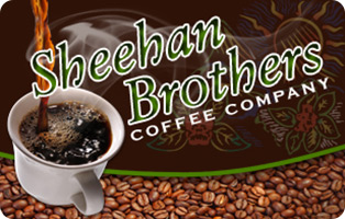 A mug with coffee being poured into the mug with the words Sheehan Brothers Coffee Company